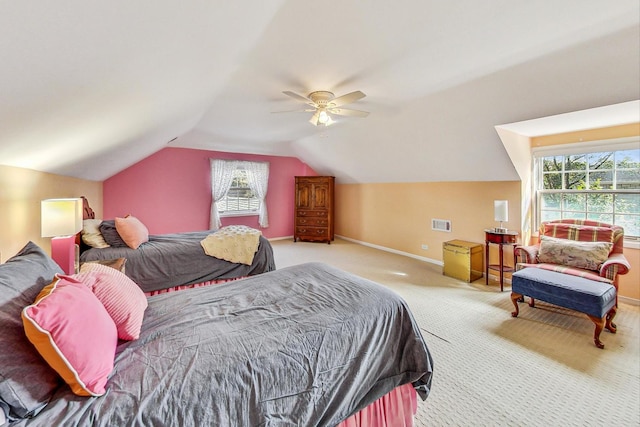 carpeted bedroom featuring vaulted ceiling and ceiling fan