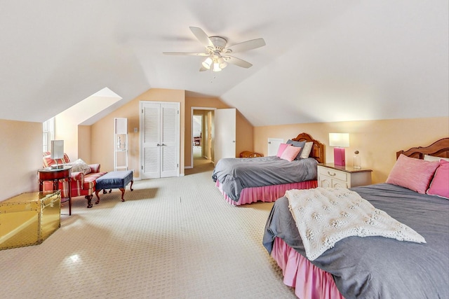 carpeted bedroom with vaulted ceiling and ceiling fan