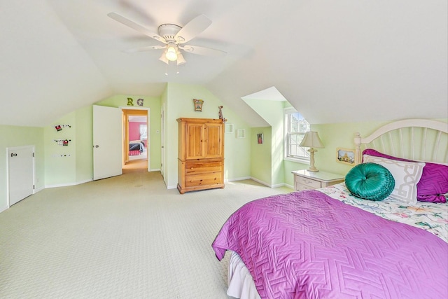 carpeted bedroom with lofted ceiling and ceiling fan