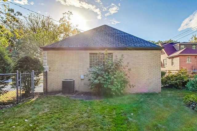 view of home's exterior featuring a yard and cooling unit