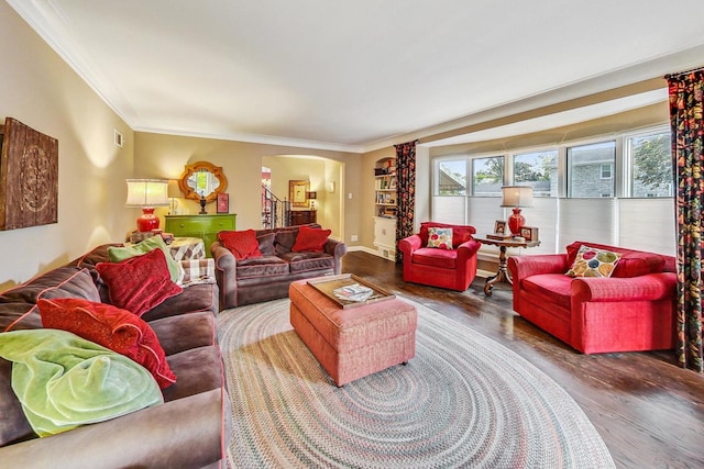 living room with crown molding and hardwood / wood-style floors