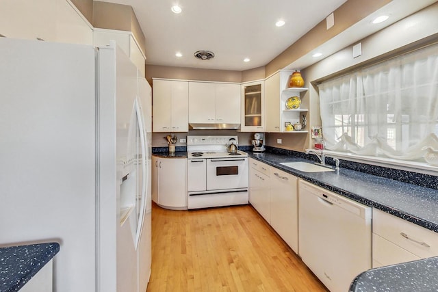 kitchen featuring white appliances, light hardwood / wood-style flooring, white cabinetry, and sink