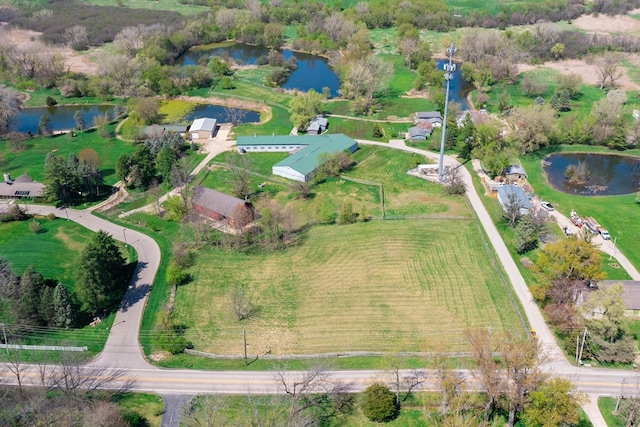 drone / aerial view featuring a rural view and a water view