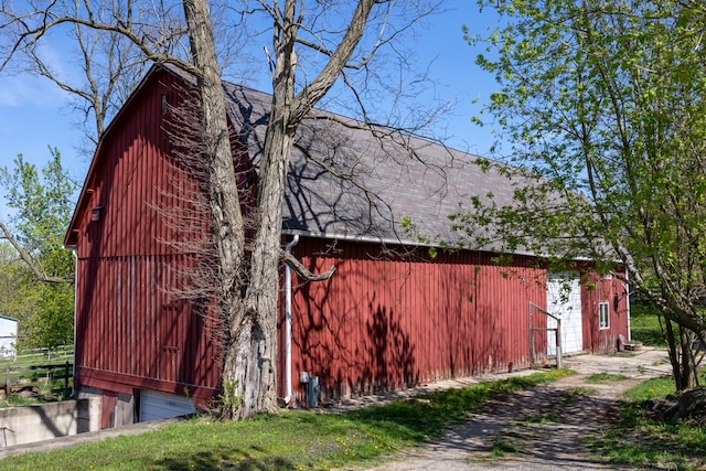 view of property exterior featuring an outdoor structure