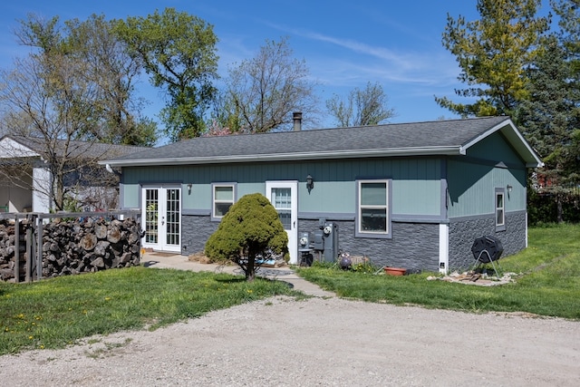 view of front of property featuring french doors and a front yard