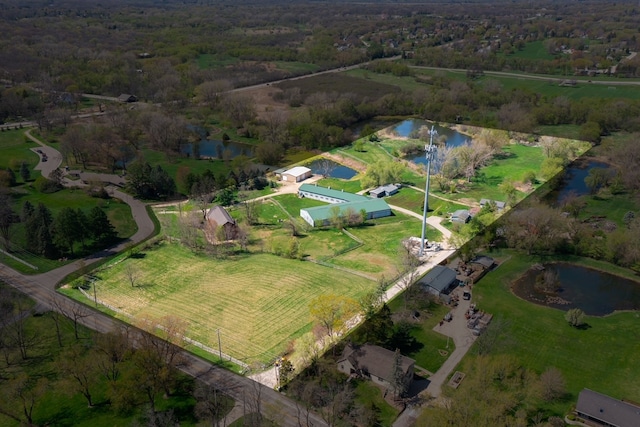 drone / aerial view featuring a water view and a rural view