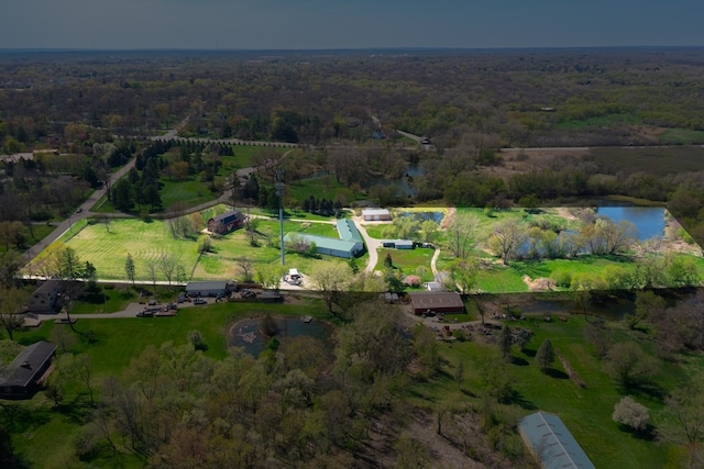 drone / aerial view featuring a water view and a rural view