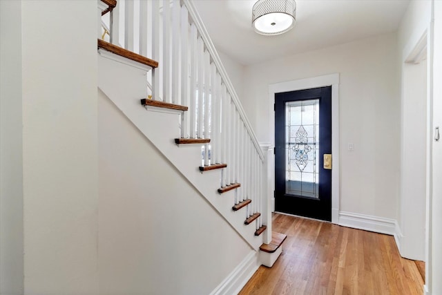 entrance foyer featuring baseboards and light wood-style floors