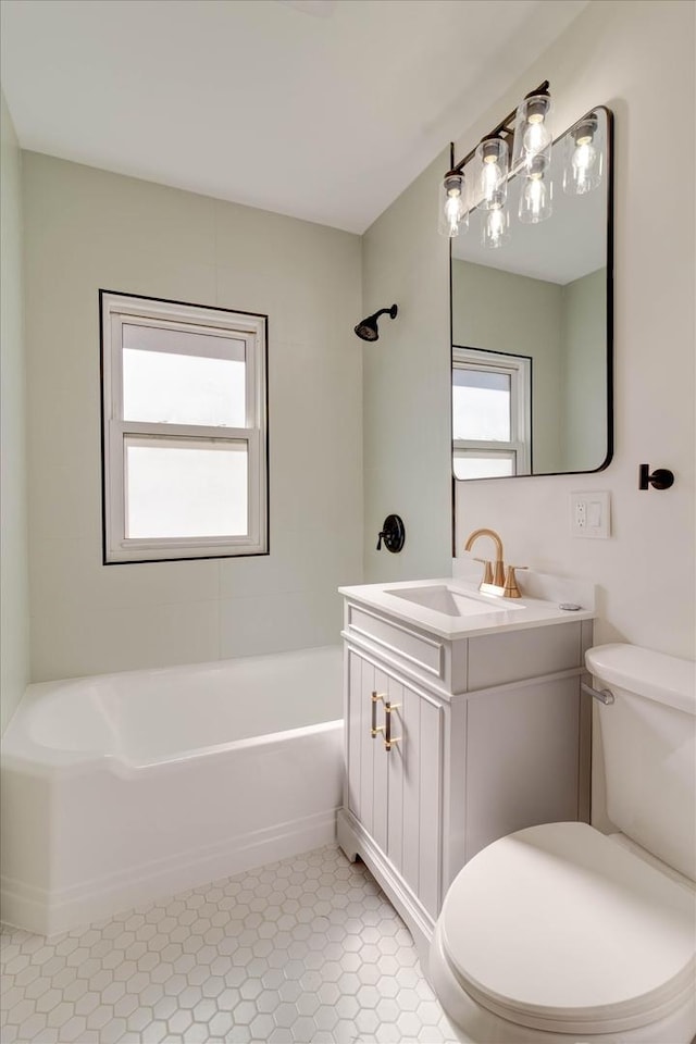 bathroom with tile patterned flooring, vanity, toilet, and shower / bathtub combination