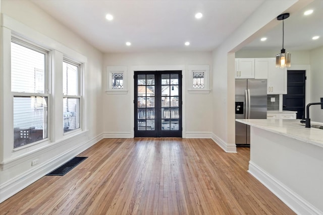 foyer with french doors, recessed lighting, visible vents, light wood-type flooring, and baseboards