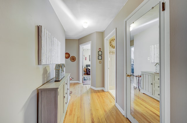 corridor featuring light hardwood / wood-style floors