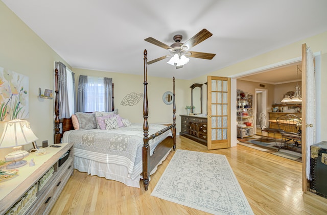 bedroom featuring light wood-type flooring and ceiling fan