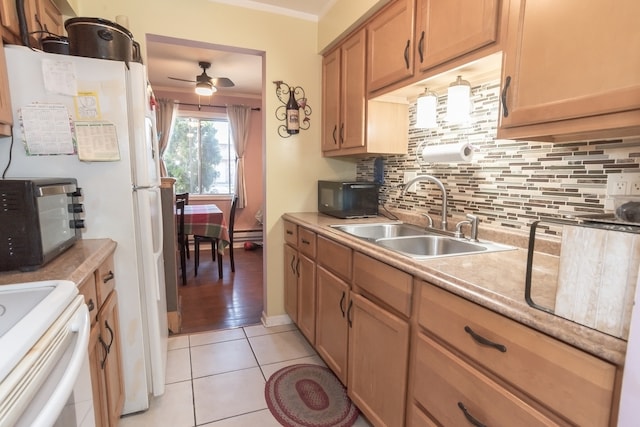 kitchen with light tile patterned flooring, sink, ceiling fan, crown molding, and decorative backsplash