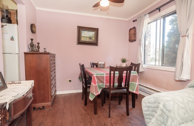 dining space with a baseboard radiator, crown molding, ceiling fan, and dark hardwood / wood-style flooring