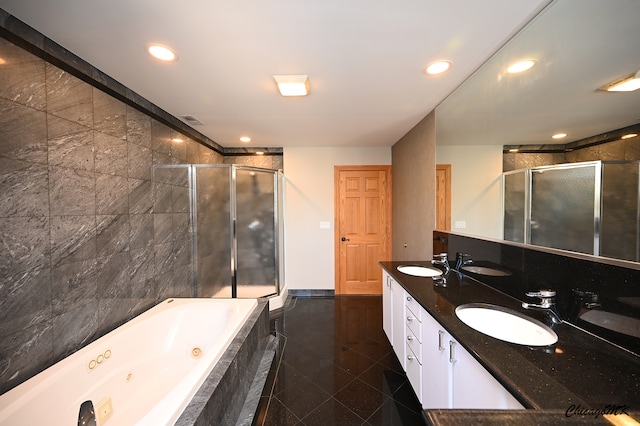 bathroom with plus walk in shower, vanity, and tile patterned floors