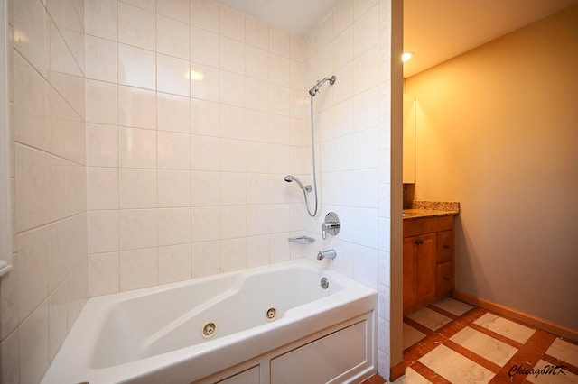 bathroom with vanity and tiled shower / bath combo