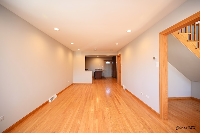 unfurnished living room with light hardwood / wood-style flooring