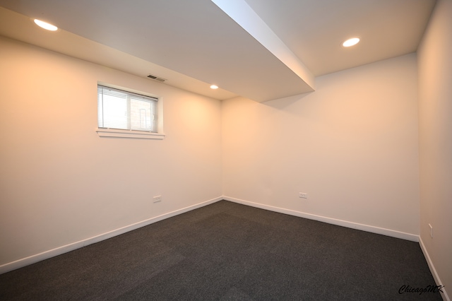 basement with dark carpet