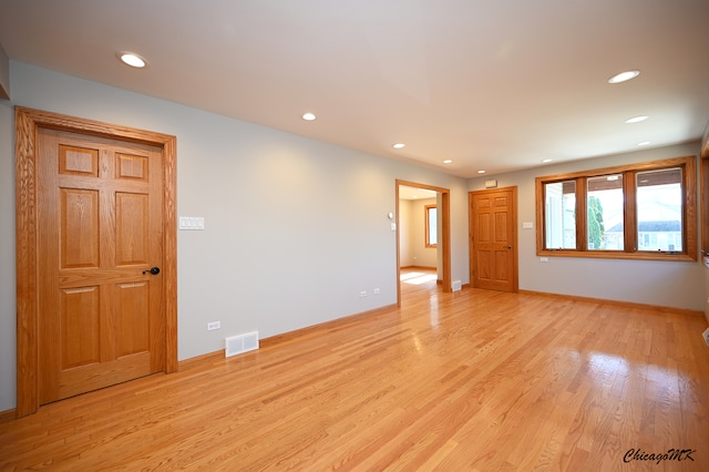 spare room featuring light wood-type flooring