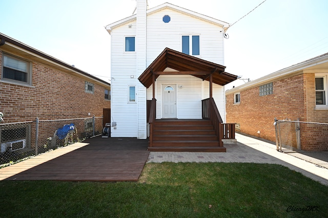 rear view of house with a lawn