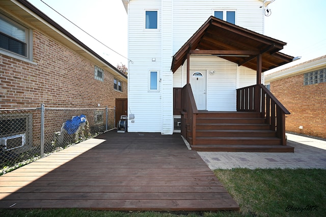 rear view of property with a deck