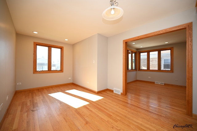 spare room with light hardwood / wood-style floors