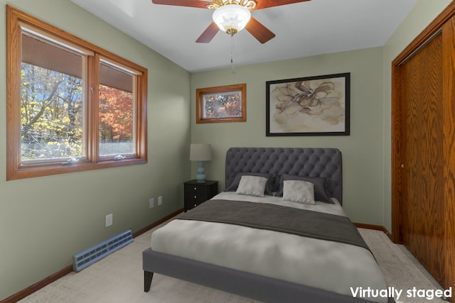 carpeted bedroom featuring ceiling fan