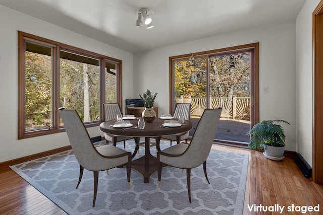 dining area featuring hardwood / wood-style floors and a wealth of natural light