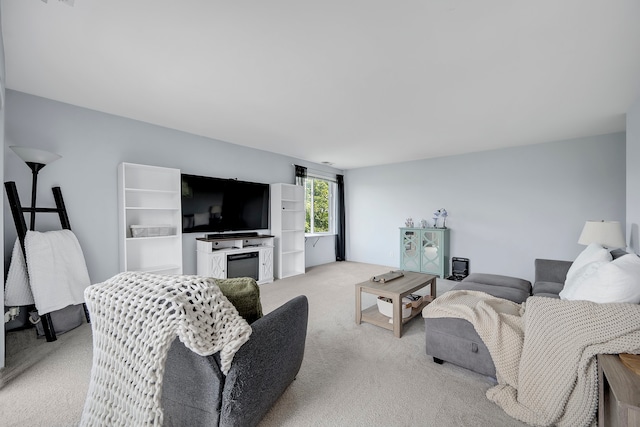 living room featuring light colored carpet