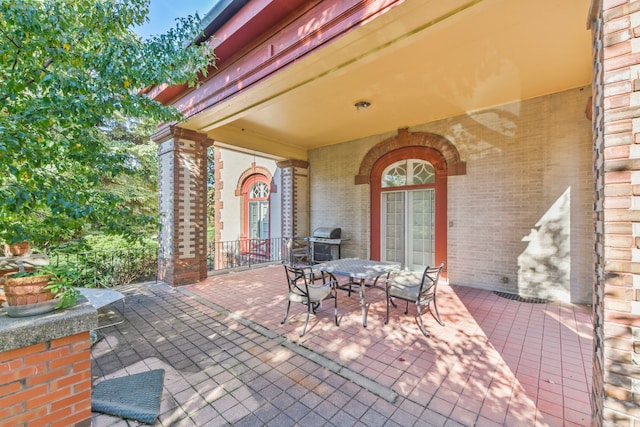 view of patio featuring a grill