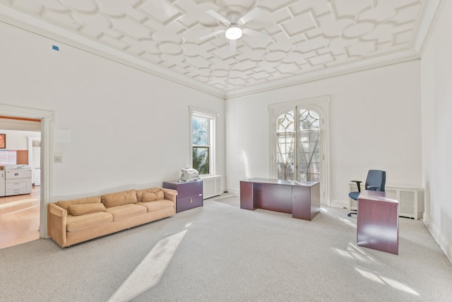 home office featuring crown molding, carpet floors, and ceiling fan