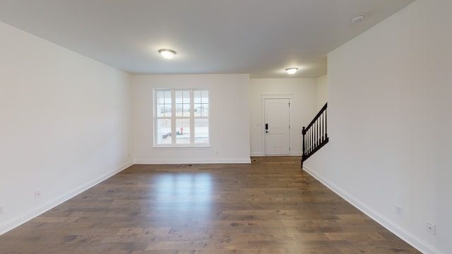 foyer entrance featuring dark hardwood / wood-style floors