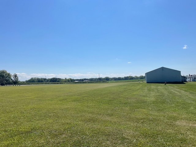 view of yard with a rural view