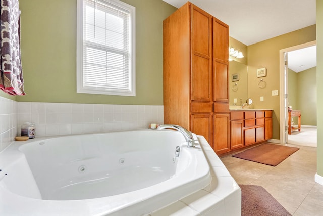 bathroom with vanity, tiled tub, and tile patterned floors