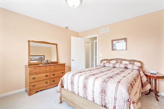 bedroom with light colored carpet