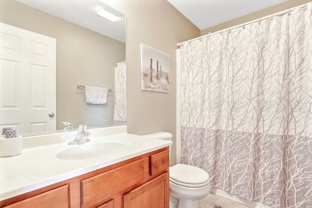 bathroom with vanity, toilet, tile patterned floors, and curtained shower