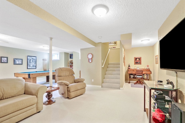 living room with pool table, light carpet, and a textured ceiling