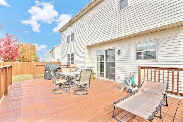 wooden deck featuring area for grilling