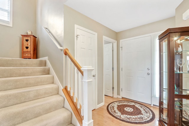 foyer entrance with wood-type flooring