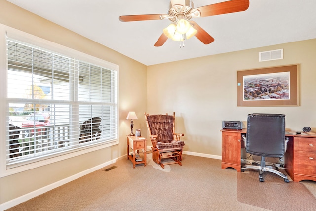 office space with carpet flooring and ceiling fan