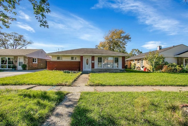 single story home with a front yard