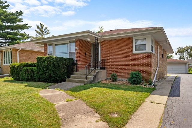 view of front of property with a garage and a front lawn