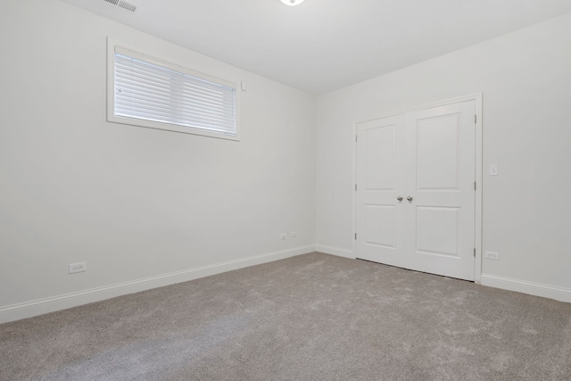 6832 S Cornell Ave Unit 1, Chicago, IL 60649 - empty room with baseboards and carpet