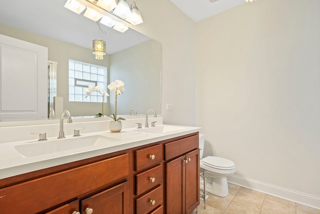 6832 S Cornell Ave Unit 1, Chicago, IL 60649 - full bathroom featuring toilet, tile patterned floors, a sink, and double vanity
