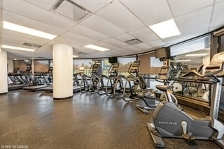 gym featuring a paneled ceiling