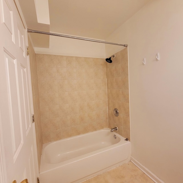 bathroom featuring tiled shower / bath and tile patterned floors