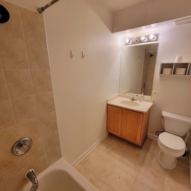 full bathroom featuring vanity, tiled shower / bath combo, toilet, and tile patterned floors