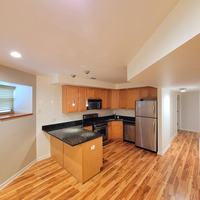 4600 S Indiana Ave Unit Gs, Chicago, IL 60653 - kitchen featuring stainless steel appliances, a peninsula, light wood-type flooring, a sink, and recessed lighting
