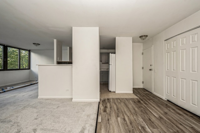 unfurnished living room featuring hardwood / wood-style flooring