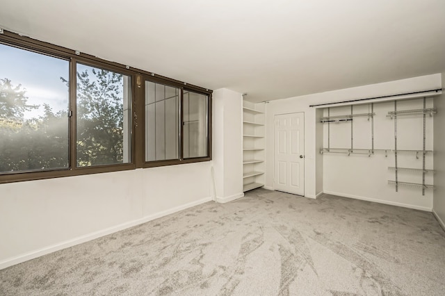 unfurnished bedroom with light colored carpet